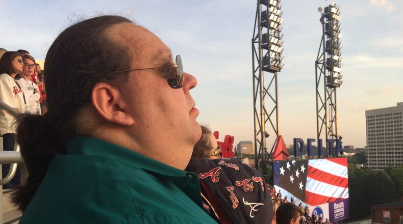 Joey Stuckey stands at attention during the National Anthem at the Braves home opener at SunTrust Park last Friday evening. Photo by Jill Vejnoska/jvejnoska@ajc.com