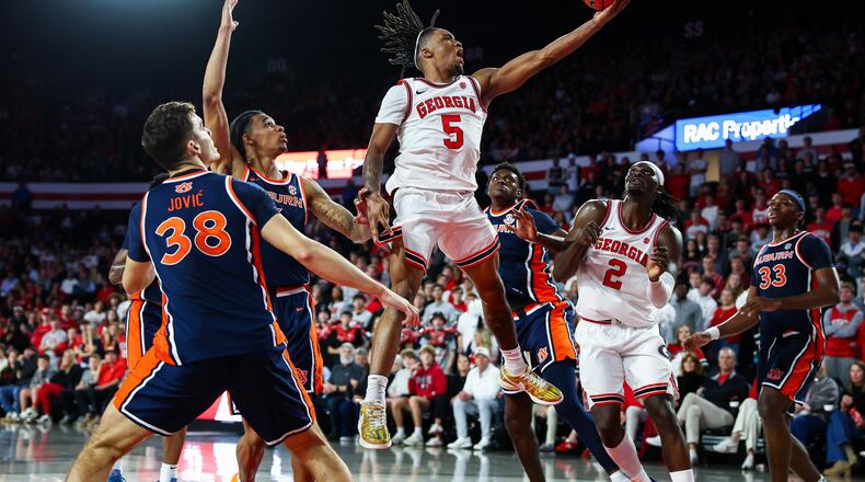 Georgia guard Jeremiah Wilkinson shoots against Auburn forward Filip Jovic during the first half of an NCAA college basketball game, Saturday, Jan. 3, 2026, in Athens, Ga. (Colin Hubbard/AP)