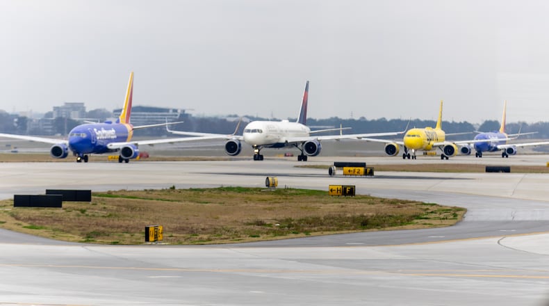 Jets line up at Hartsfield-Jackson Atlanta International Airport on Tuesday, December 13, 2022    (Steve Schaefer/steve.schaefer@ajc.com)