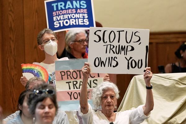 Transgender rights supporters rally at the Lutheran Church of the Reformation on Capitol Hill, Wednesday, June 18, 2025, in Washington, after the Supreme Court upheld Tennessee's ban on gender-affirming care for transgender minors, in a setback to transgender rights. (AP Photo/Mariam Zuhaib)