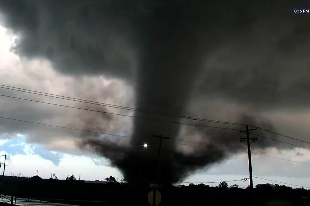 In this image taken from video from KWTV/KOTV, a tornado crosses a highway in Enid, Okla., Thursday, April 23, 2026. (KWTV/KOTV via AP)