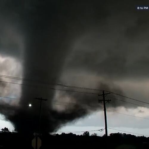 In this image taken from video from KWTV/KOTV, a tornado crosses a highway in Enid, Okla., Thursday, April 23, 2026. (KWTV/KOTV via AP)
