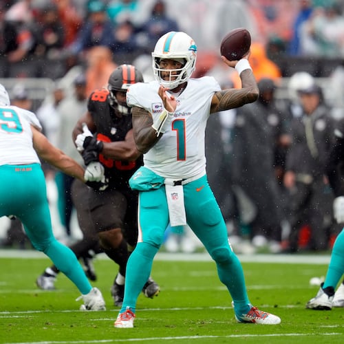 Miami Dolphins quarterback Tua Tagovailoa (center) passes against the Cleveland Browns in the first half of an NFL game in Cleveland, Sunday, Oct. 19, 2025. (Sue Ogrocki/AP)