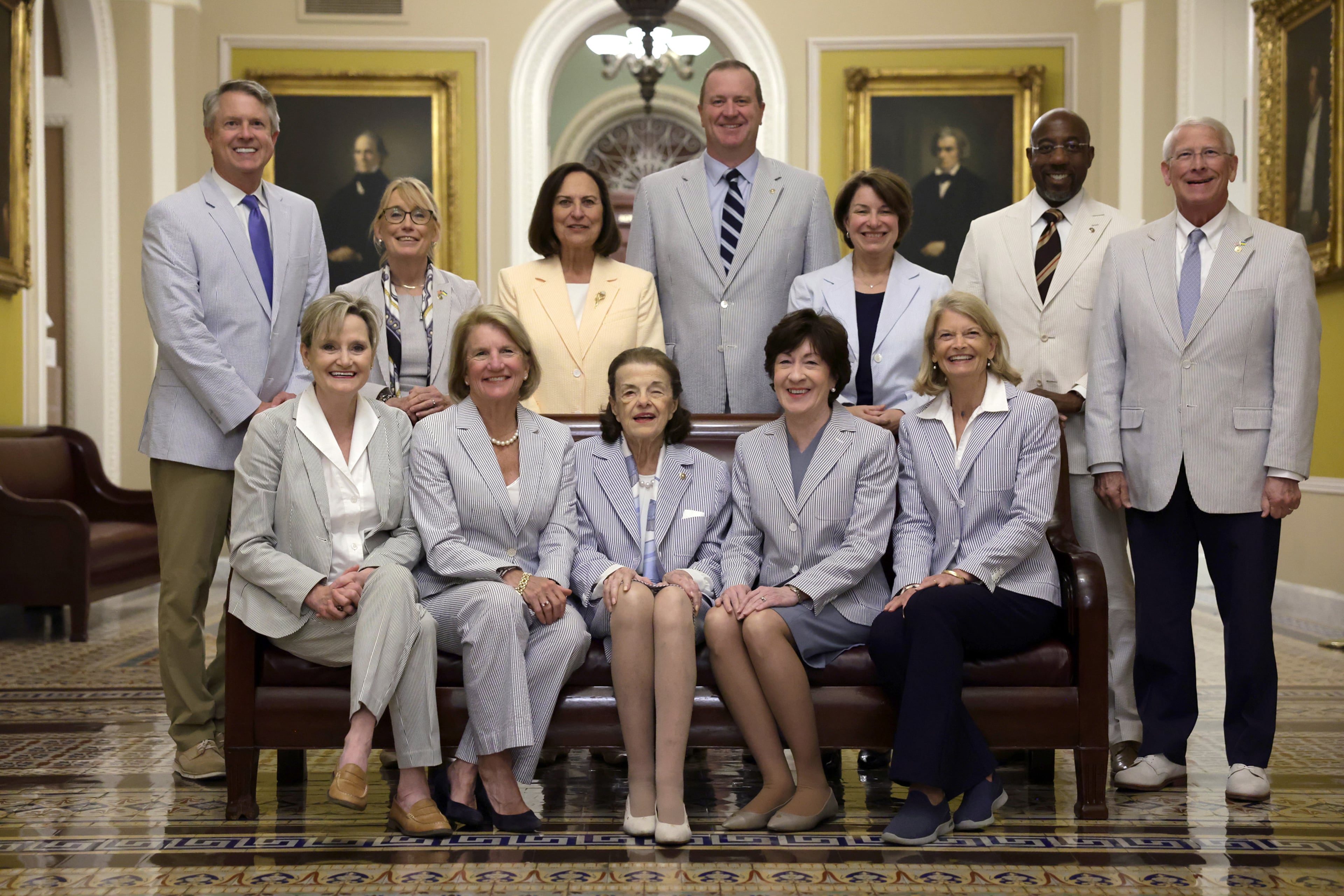 Members of Congress, including Georgia U.S. Sen. Raphael Warnock (back row, second from right) participated in National Seersucker Day at the Capitol in 2023.