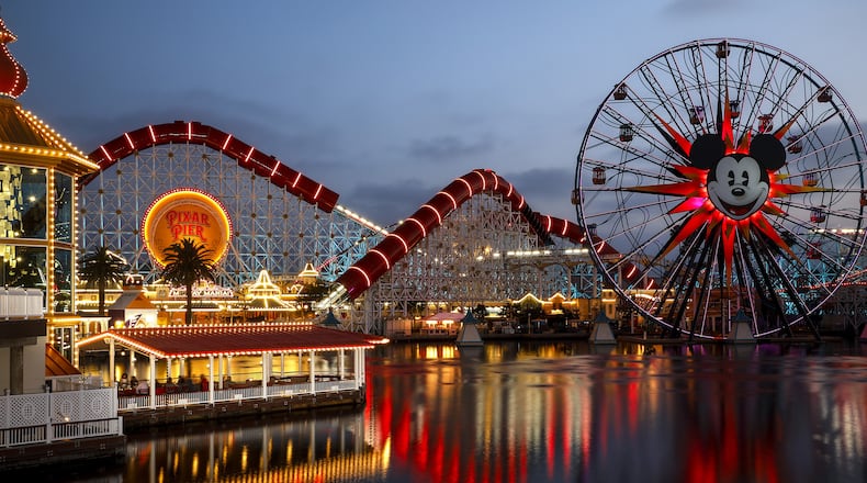 Leaving Pixar Pier at Disney California Adventure Park at the end of a day of press preview in Anaheim, Calif. on June 21, 2018. (Jay L. Clendenin/Los Angeles Times/TNS)
