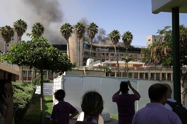 Smokes raises from a building of the Soroka hospital complex after it was hit by a missile fired from Iran in Be'er Sheva, Israel, Thursday, June 19, 2025. (AP Photo/Leo Correa)