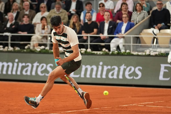 Spain's Carlos Alcaraz plays a shot against Italy's Lorenzo Musetti during their semifinal match of the French Tennis Open at the Roland-Garros stadium in Paris, Friday, June 6, 2025. (AP Photo/Thibault Camus)
