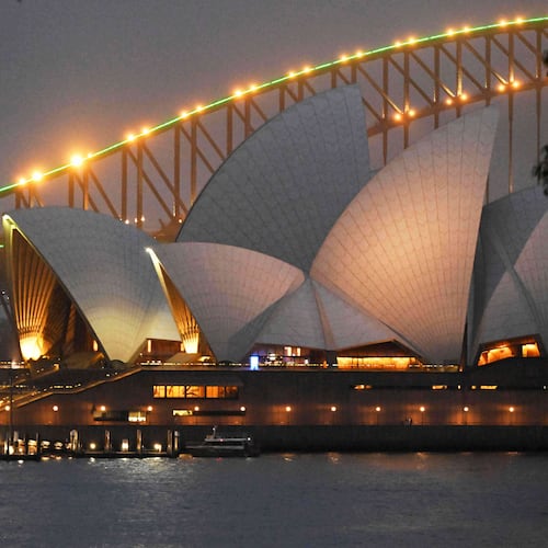 The social media ban for children under 16 slogan "Let Them Be Kids" is projected onto the pylons of the Sydney Harbour Bridge in Sydney, Wednesday, Dec. 10, 2025. (Mick Tsikas/AAP Image via AP)