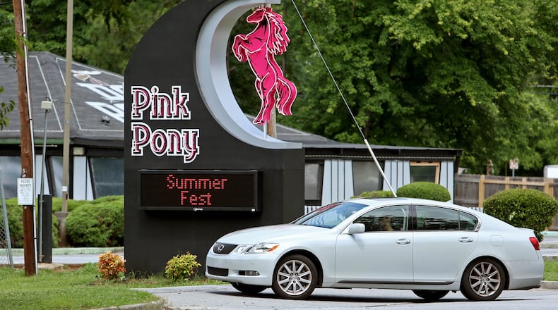 An automobile pulls into the parking lot of the Pink Pony off of Buford Highway in Brookhaven in this AJC file photo. JASON GETZ / JGETZ@AJC.COM