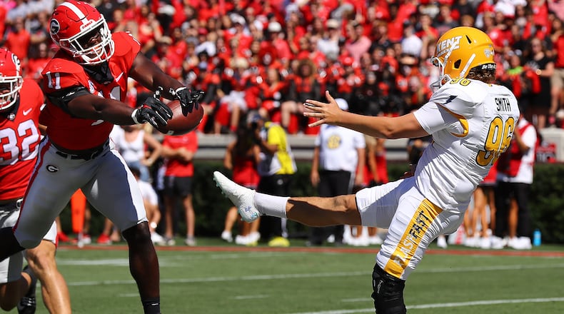 Georgia inside linebacker Jalon Walker blocks a punt in the end zone by Kent State punter Josh Smith for a safety to take a 9-3 lead during the first quarter Saturday, Sept. 24, 2022, in Athens. “Curtis Compton / Curtis Compton@ajc.com