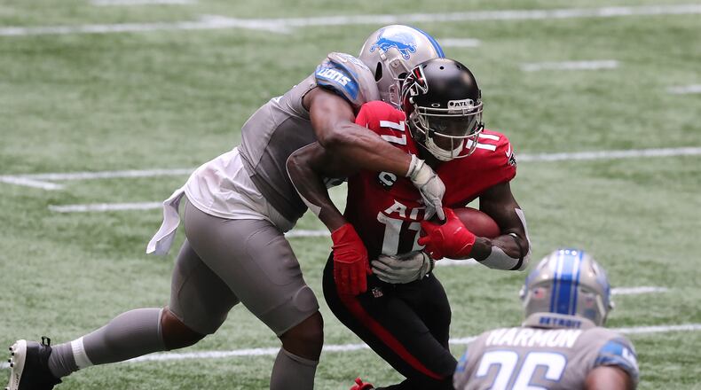 Falcons wide receiver Julio Jones makes a first-down reception against the Detroit Lions during the first half Sunday, Oct. 25, 2020, at Mercedes-Benz Stadium in Atlanta. (Curtis Compton / Curtis.Compton@ajc.com)