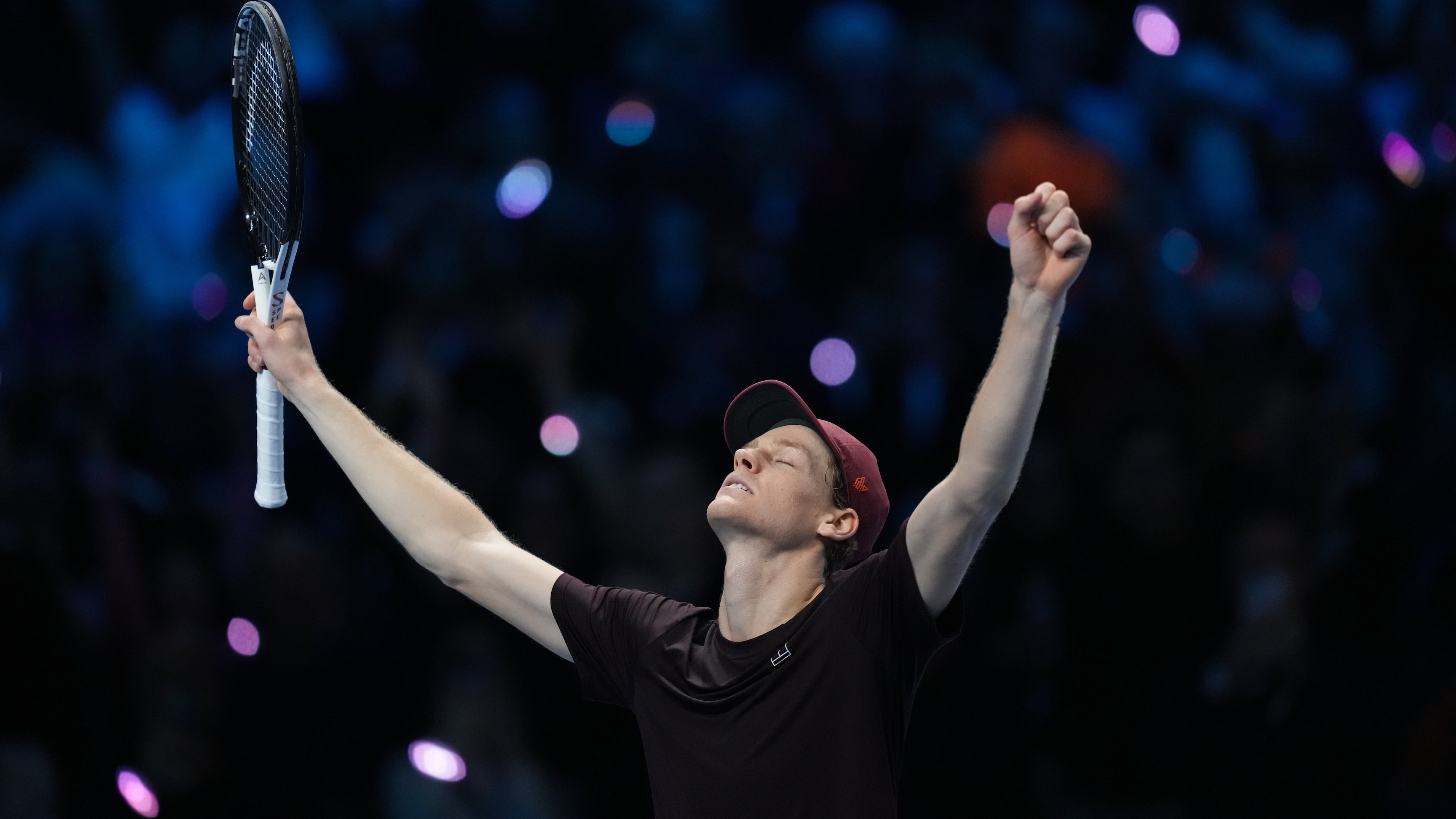 Italy's Jannik Sinner reacts after winning the final tennis match of the ATP World Tour Finals against Spain's Carlos Alcaraz in Turin, Italy, Sunday, Nov. 16, 2025. (AP Photo/Antonio Calanni)