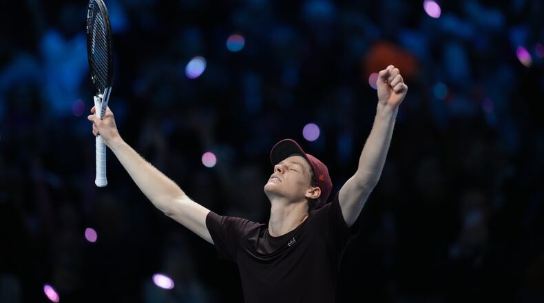 Italy's Jannik Sinner reacts after winning the final tennis match of the ATP World Tour Finals against Spain's Carlos Alcaraz in Turin, Italy, Sunday, Nov. 16, 2025. (AP Photo/Antonio Calanni)