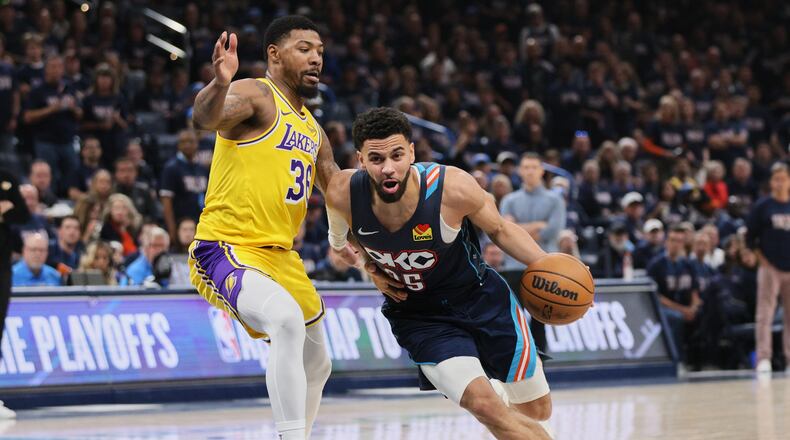 Oklahoma City Thunder guard Ajay Mitchell (25) drives to the basket against Los Angeles Lakers' Marcus Smart (36) in the second half of Game 2 in a second-round NBA basketball playoffs series Thursday, May 7, 2026, in Oklahoma City. (AP Photo/Nate Billings)