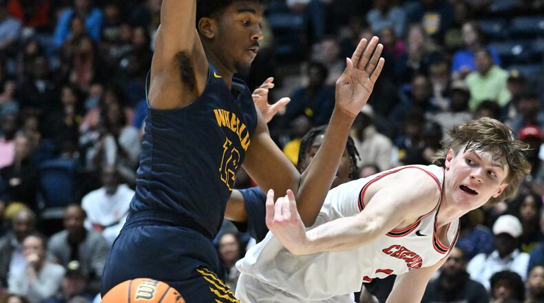 Cherokee's Cameron Pope (1) gets off a pass around Wheeler's Cameron Brown (13) during 2023 GHSA Basketball Class 7A Boy’s State Championship game at the Macon Centreplex, Saturday, March 11, 2023, in Macon, GA. (Hyosub Shin / Hyosub.Shin@ajc.com)