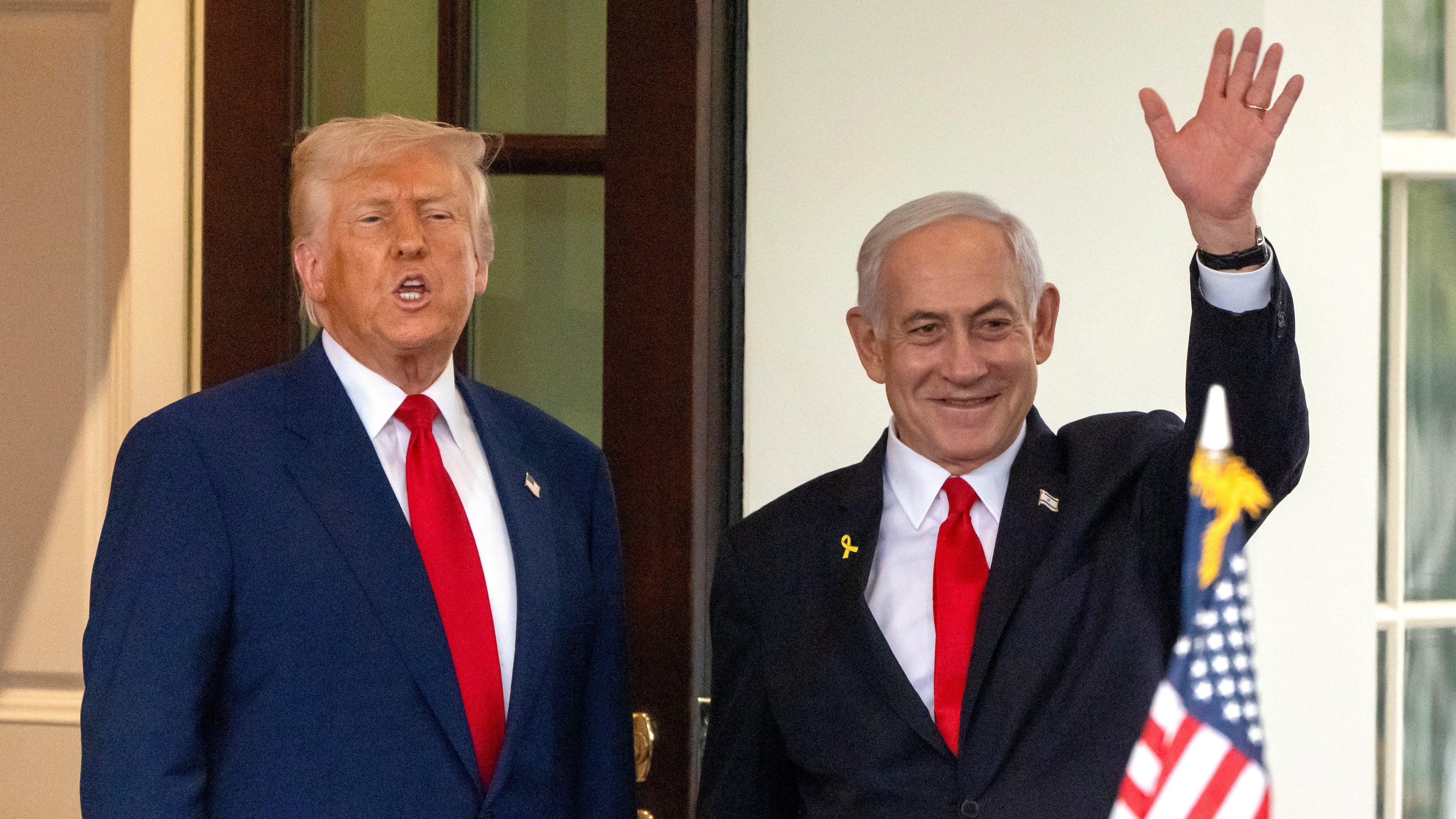 FILE - President Donald Trump, left, speaks as Israel's Prime Minister Benjamin Netanyahu waves upon leaving the West Wing of the White House, April 7, 2025, in Washington. (AP Photo/Mark Schiefelbein, File)