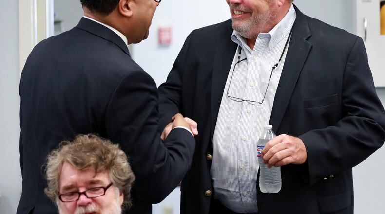 July 11, 2019 Fort Mac: Fort Mac LRA board chairman Cassius Butts (left) greets developer Stephen Macauley (right) as he arrives for the McPherson Implementing Local Redevelopment Authority Board Meeting at Fort Mac LRA on Thursday, July 11, 2019, in Atlanta. Curtis Compton/ccompton@ajc.com