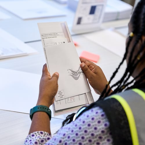 Wake County Board of Elections employees prepare absentee ballots to be mailed on Thursday, Sept. 3, 2026, in Raleigh, N.C. (AP Photo/Matt Ramey)