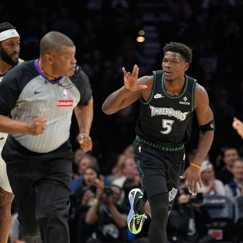 Minnesota Timberwolves guard Anthony Edwards (5) gestures after making a basket during the first half of an NBA basketball game against the Indiana Pacers, Sunday, Oct. 26, 2025, in Minneapolis. (AP Photo/Abbie Parr)