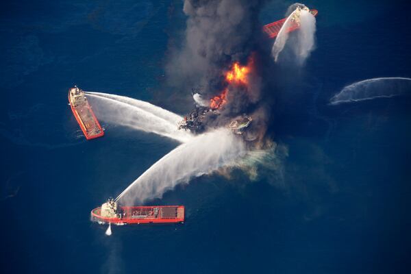 FILE - The Deepwater Horizon oil rig burns in the Gulf of Mexico on April 21, 2010, following an explosion that killed 11 workers and caused the worst offshore oil spill in the nation's history. (AP Photo/Gerald Herbert, File)
