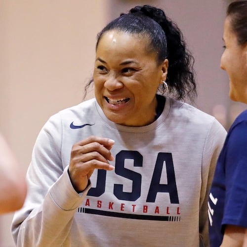 FILE - Coach Dawn Staley talks with players and assistant coaches during a practice for the U.S. women's basketball team in Seattle on April 24, 2018. (AP Photo/Elaine Thompson, File)