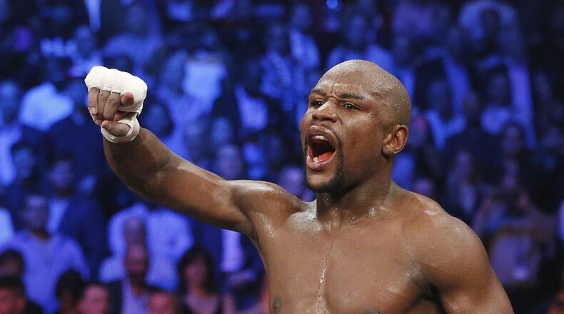 Floyd Mayweather Jr. celebrates his unanimous decision victory over Manny Pacquiao, from the Philippines, at the finish of their welterweight title fight on May 2, 2015, in Las Vegas.