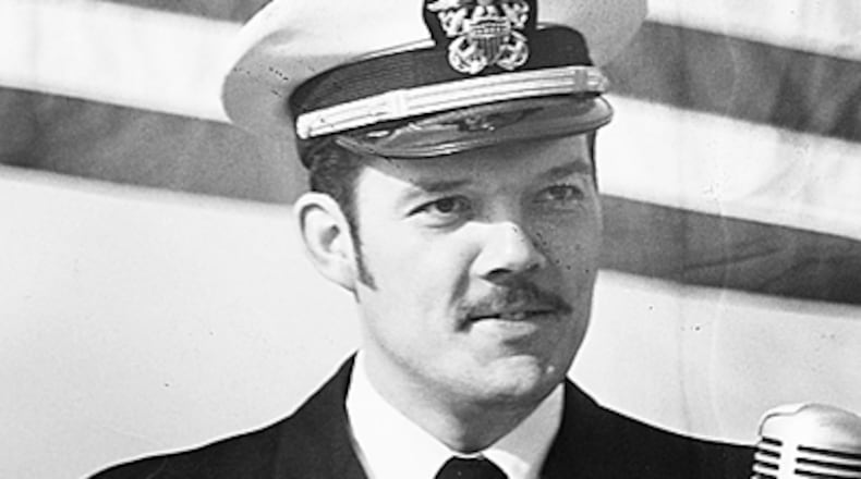 Navy Lt. Commander Mike Christian of Huntsville, Ala., addresses the crowd during “Mike Christian Day” on April 7, 1973 in Huntsville after returning home from spending six years as a POW in Vietnam. Republican presidential candidate John McCain often talks about Christian, a cellmate in Vietnam, and how he was an inspiration for him and other prisoners of war. Christian died in September 1983. (AP Photo/Huntsville Madison County Public Library)