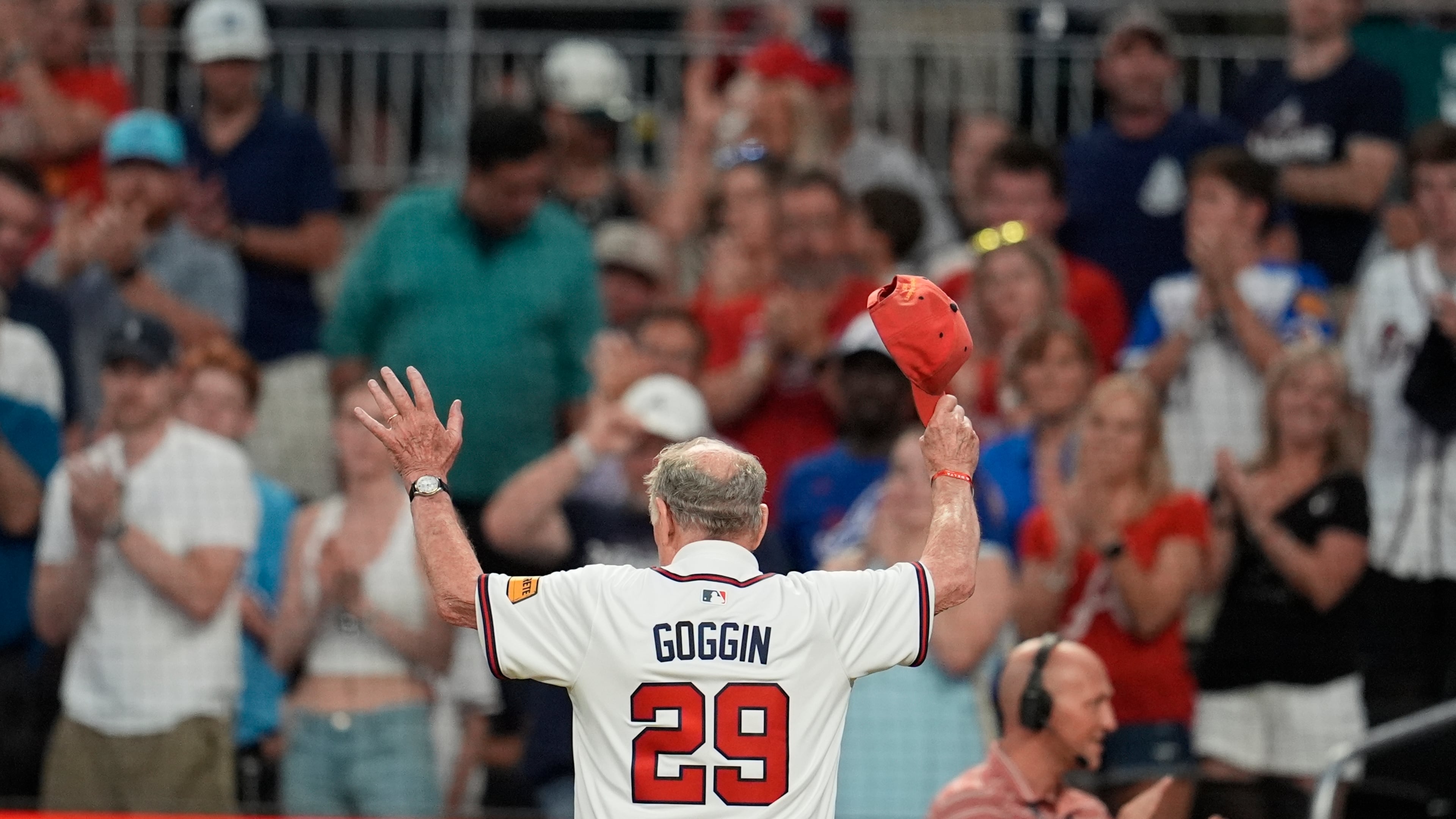 Former U.S. Marine and Braves player Charles Goggin is honored between innings during Friday's game against the Colorado Rockies in Atlanta. (Mike Stewart/AP)