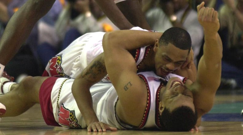 Maryland players Juan Dixon (top) and Lonny Baxter celebrate after winning the NCAA Championship game against Indiana on April 1, 2002 at the Georgia Dome.