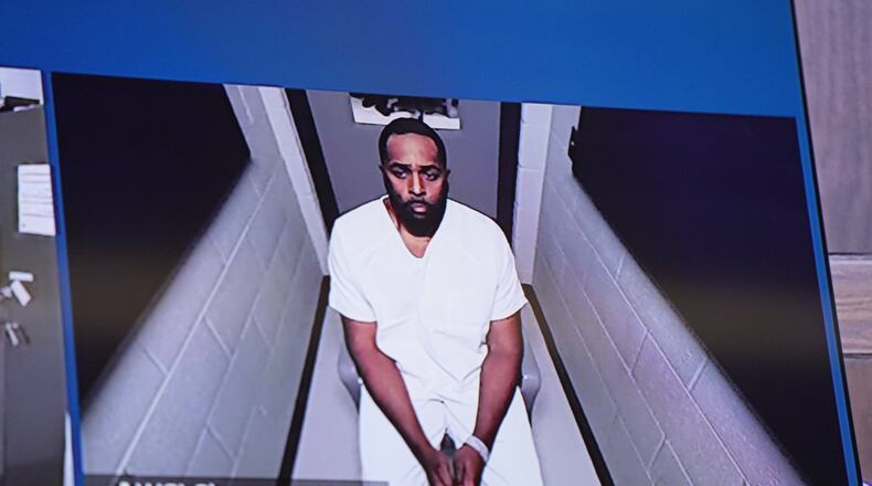 Fired Michigan football coach Sherrone Moore appears via video in court on Friday, Dec. 12, 2025 in Ann Arbor, Mich. (AP Photo/ Ryan Sun, Pool)