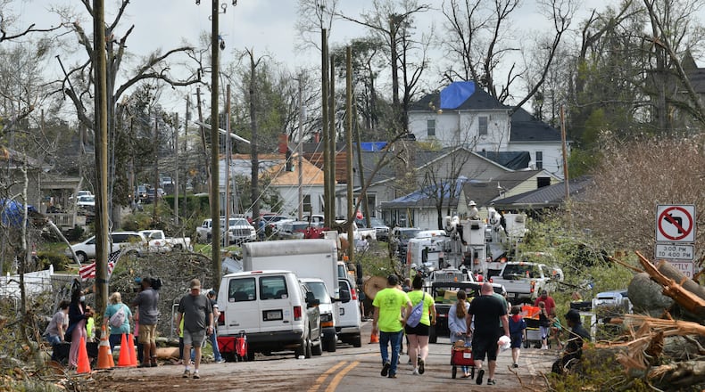 Cleanup from the tornado in Coweta County will continue for weeks, with state and county crews working 12 hours a day to remove trees and an estimated 500,000 cubic yards of debris.