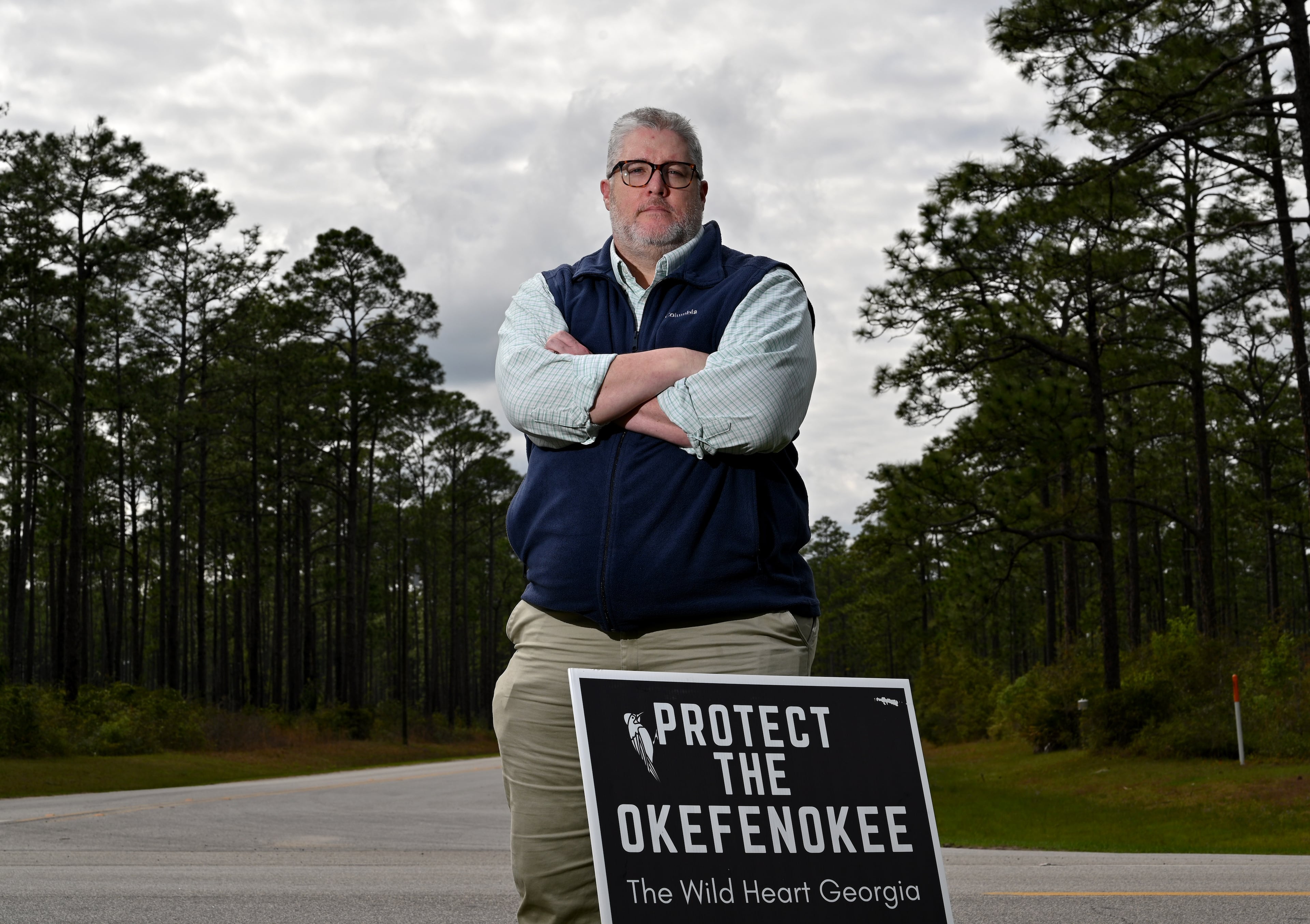Josh Howard, the president of the nonprofit Friends of the Okefenokee National Wildlife Refuge, stands near the main entrance of the refuge in Folkston. (Hyosub Shin/AJC 2024)