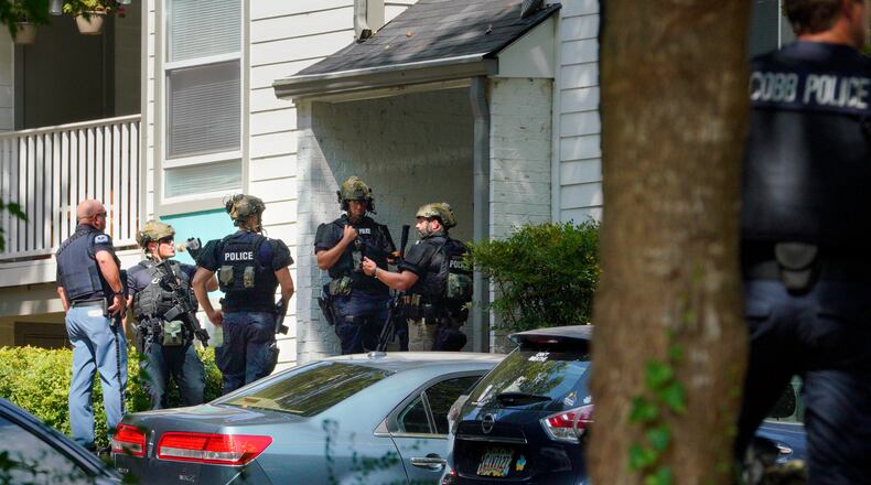 Cobb County SWAT officers responded to a hostage situation at an apartment Monday morning.