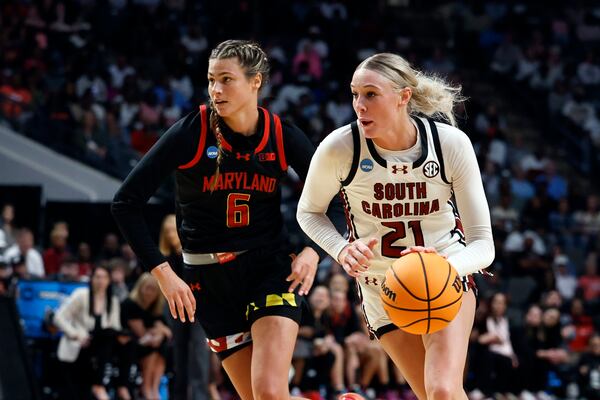 South Carolina forward Chloe Kitts (21) dribbles around Maryland guard Saylor Poffenbarger (6) during the second half in the Sweet 16 of the NCAA college basketball tournament, Friday, March 28, 2025, in Birmingham, Ala. (AP Photo/Butch Dill)