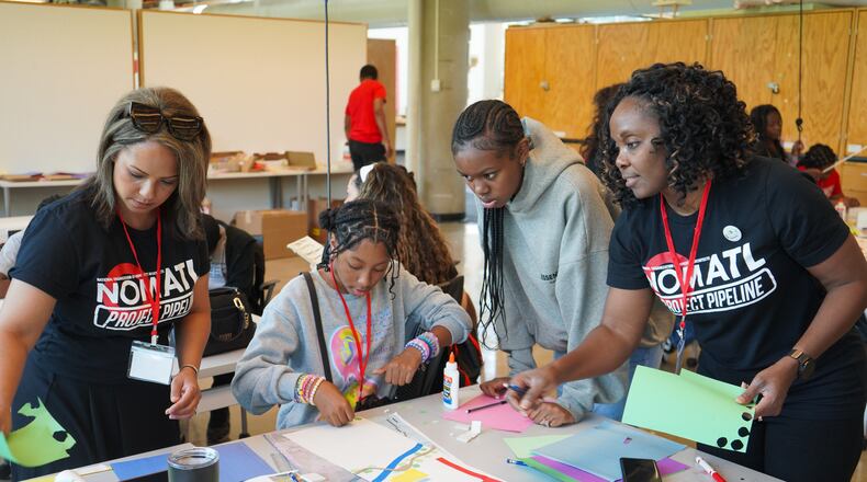 NOMA Atlanta member Crysta Hailes (left) and chapter President Shelly-Anne Tulia Scott work with students during the 2024 summer camp at Georgia Tech. Courtesy