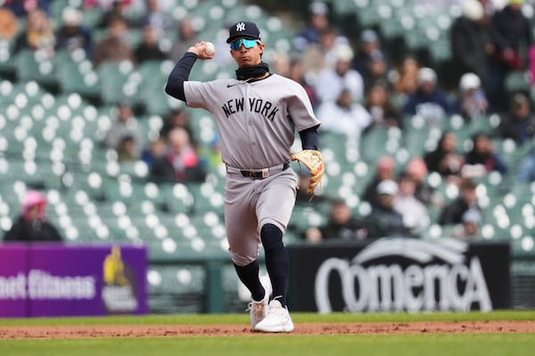 New York Yankees third baseman Oswaldo Cabrera throws to first base for an out against the Detroit Tigers in the first inning during a baseball game, Wednesday, April 9, 2025, in Detroit. (AP Photo/Paul Sancya)