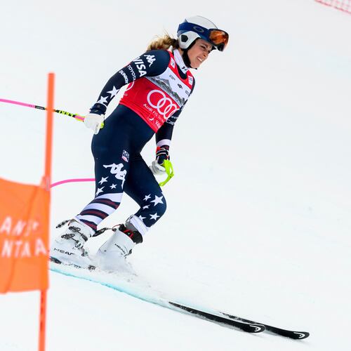 United States' Lindsey Vonn grimaces as she approaches the finish area after crashing, during an alpine ski, women’s World Cup downhill, in Crans Montana, Switzerland, Friday, Jan. 30, 2026. (Jean-Christophe Bott/Keystone via AP)