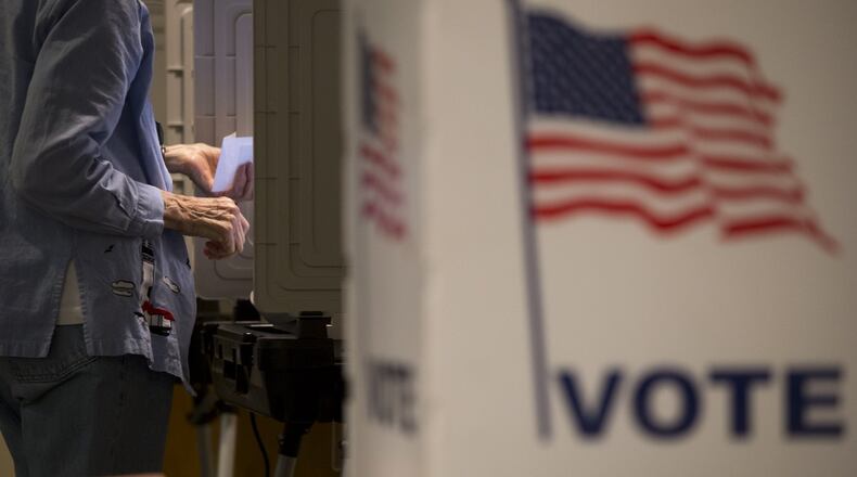 An election transparency group has called for Georgia to abandon electronic voting in next week’s election. (CASEY SYKES / CASEY.SYKES@AJC.COM)