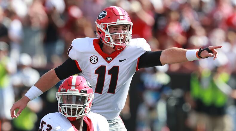 UGA QB Jake Fromm calls an audible at the line of scrimmage against South Carolina during the first half in a NCAA college football game on Saturday, Sept 8, 2018, in Columbia.  Curtis Compton/ccompton@ajc.com