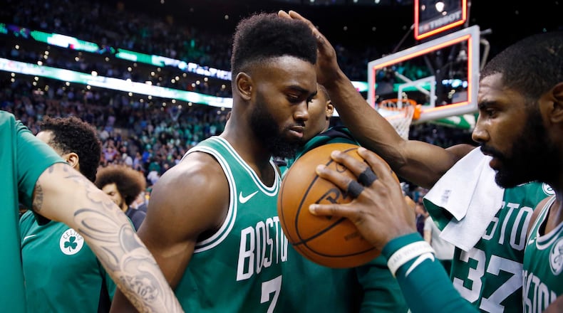 Jaylen Brown, center, with teammate Kyrie Irving, right, after defeating Golden State in November. “This one’s for Trevin,” Irving said, referring to a close friend of Brown’s in Atlanta who had died the night before the game.