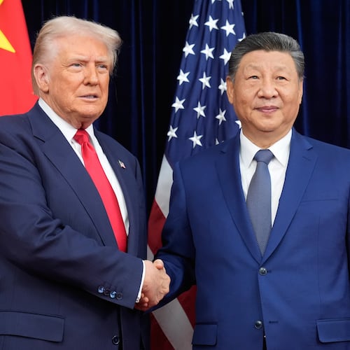 President Donald Trump, left, and Chinese President Xi Jinping shake hands before their meeting at Gimhae International Airport in Busan, South Korea, Thursday, Oct. 30, 2025. (AP Photo/Mark Schiefelbein)