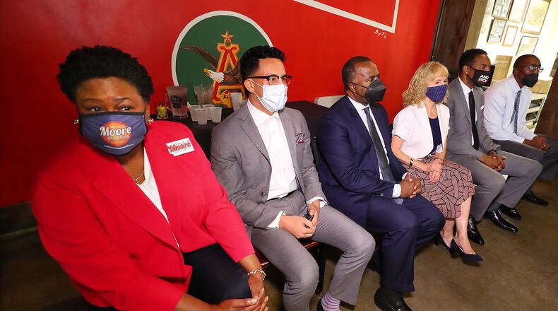 080421 Atlanta: Mayoral candidates Council President Felicia Moore (from left), Councilman Antonio Brown, former Atlanta Mayor Kasim Reed, attorney Sharon Gay, Councilman Andre Dickens, and local businessman Richard Wright take part in a mayoral debate hosted by The Young Democrats of Atlanta at Manuel’s Tavern on Wednesday, August 4, 2021, in Atlanta.   “Curtis Compton / Curtis.Compton@ajc.com”