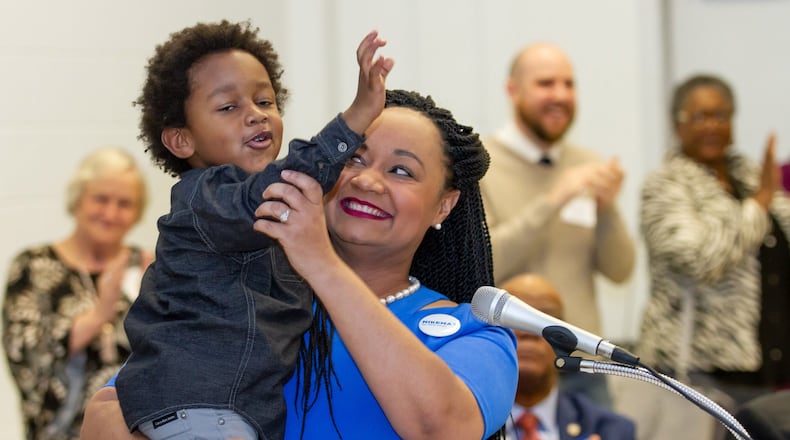 Georgia Sen. Nikema Williams, D-Atlanta, holds her son Carter Small after Williams made her bid to becom the next chairwoman of the Democratic Party of Georgia Chair. January 26, 2019. STEVE SCHAEFER / SPECIAL TO THE AJC