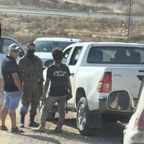 In this photo provided by Cameron Kasky, armed men block the road, stopping vehicles containing U.S. Rep. Ro Khanna, D-Calif., and his delegation near the West Bank village of Khirbet Zanuta, Wednesday, July 8, 2026. (Cameron Kasky via AP)