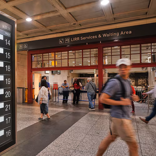 Rail passengers pass the Long Island Rail Road waiting room in Penn Station, in New York, Tuesday, May 19, 2026. (AP Photo/Richard Drew)