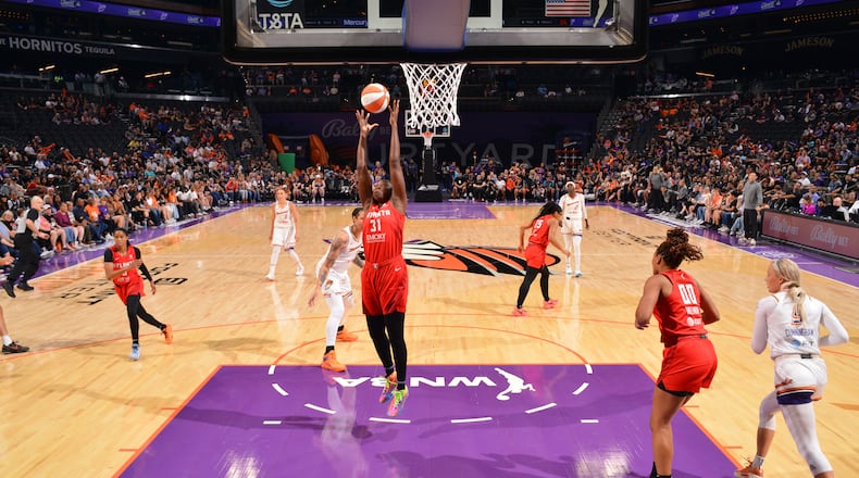 Tina Charles (31) of the Atlanta Dream rebounds the ball during the game against the Phoenix Mercury on Sept. 3, 2024 at Footprint Center in Phoenix, Arizona.