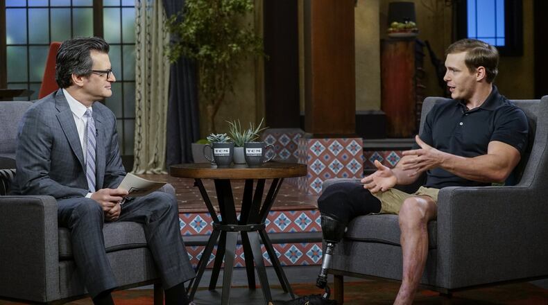 Eric Hunter lost a leg in Afghanistan and almost lost hope at Walter Reed, but fellow wounded veterans helped bring him back. He is seen here with Turner Classic Movies host Ben Mankiewicz. Hunter chose “The Green Berets” for this weekend’s TCM lineup. CONTRIBUTED BY TURNER CLASSIC MOVIES
