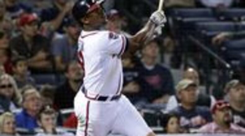Justin Upton follows through on his game-tying homer off Tyler Clippard on Friday.