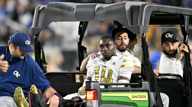 Georgia Tech defensive back Jy Gilmore (14) leaves after he got injured during the first half in an NCAA college football game at Bobby Dodd Stadium, Saturday, November 22, 2025, in Atlanta. Pittsburgh won 42-28 over Georgia Tech. (Hyosub Shin/AJC)
