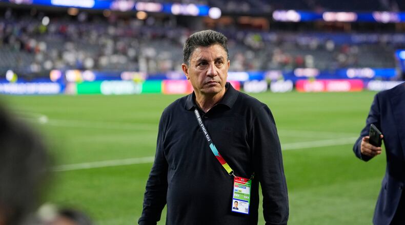 Iran head coach Amir Ghalenoei walks off the field after a draw during the World Cup Group G soccer match between Iran and New Zealand in Inglewood, Calif., near Los Angeles, Monday, June 15, 2026. (AP Photo/Mark J. Terrill)
